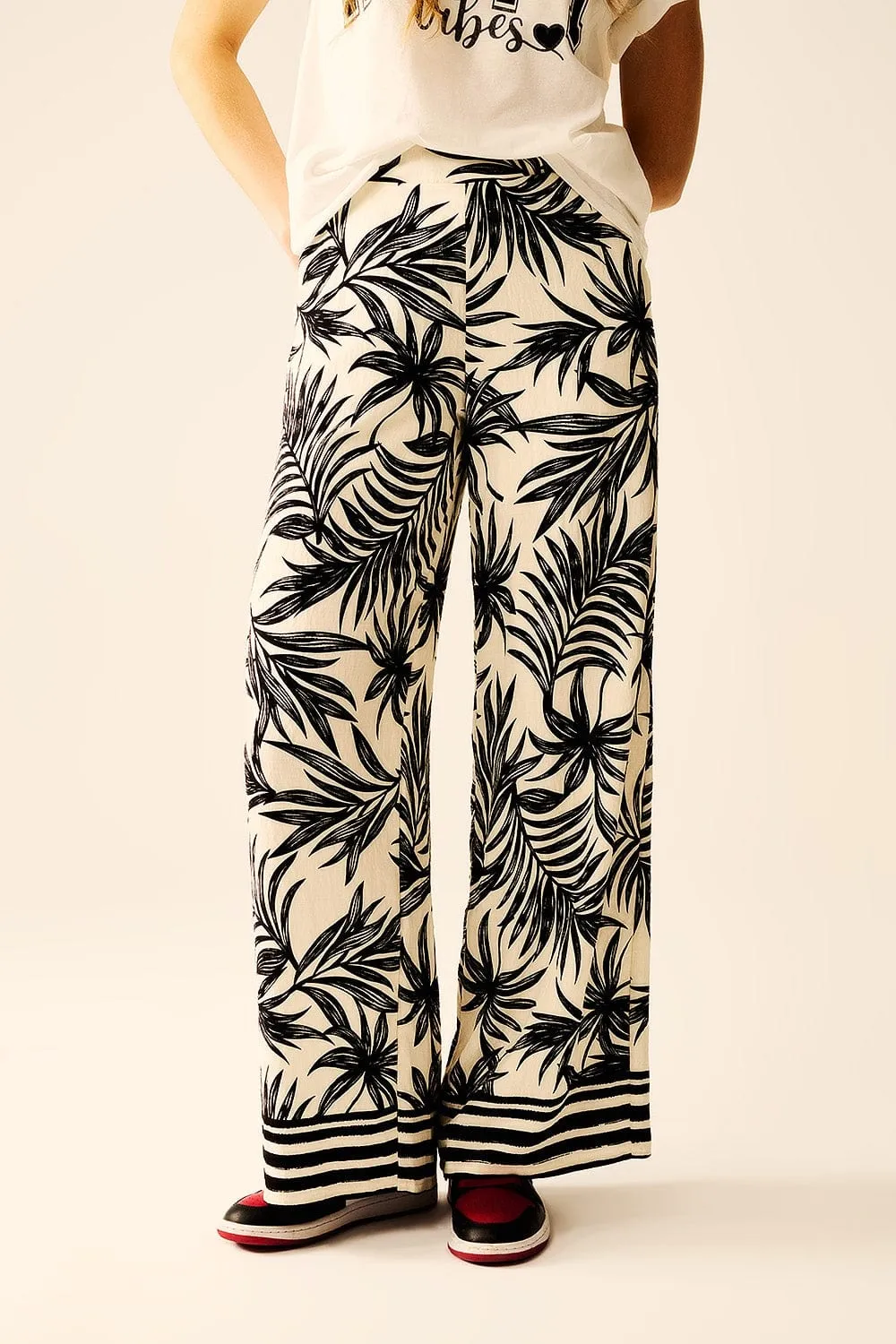 Wide Leg Pants In White With Floral Detail In Black